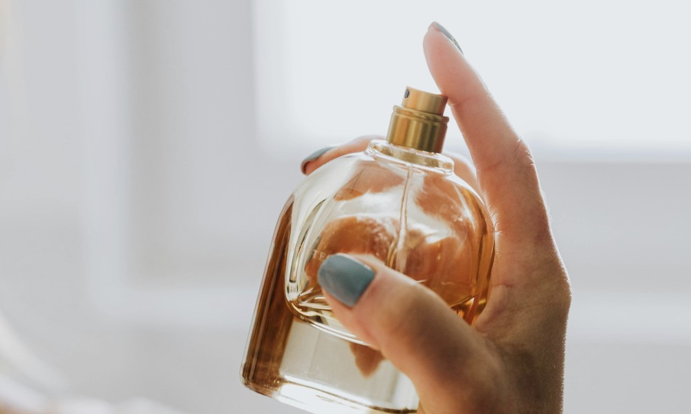 Perfume branding and storytelling shown through elegant fragrance bottle